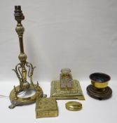 A decorative brass table-lamp base on three claw feet, together with an oval brass lidded snuff