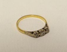 An 18ct yellow gold three stone diamond ring