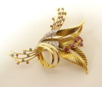 An 18ct yellow gold, ruby and diamond spray-brooch, diamonds tested, gold unmarked but stated as