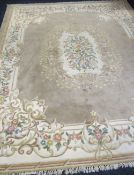 A very large floral design Belgian washed carpet, 167 x 145ins (424 x 368cms)