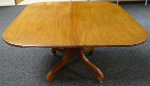 A rounded rectangular mahogany tilt-top tea table, the base with four sweeping feet, circa 1880,