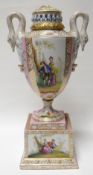An Austrian Augustus-Rex style covered campana vase with swan-handles on a square plinth base,