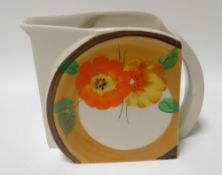 A Clarice Cliff Rhodanthe pattern wheel jug, 4ins high (10cms)