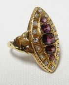 An 18ct yellow gold antique ring with marquise setting of five graduated garnets/rubies and