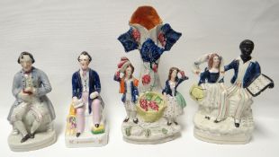 Nine nineteenth century Staffordshire figures or figural groups including Uncle Tom and R Cobden
