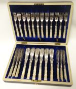 An elegant cased set of twenty-four fish knives and forks with ribbed mother-of-pearl handles