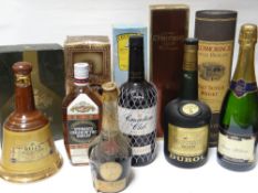 A quantity of old bottled liquors, whisky and commemorative champagne