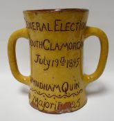 A yellow glazed Ewenny two handled mug inscribed 'GENERAL ELECTION SOUTH GLAMORGAN JULY 19TH