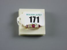An eighteen carat gold dress ring having three rubies and two diamonds, 5.6 grms