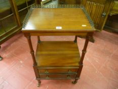 A reproduction mahogany etagere with brass pierced gallery top on turned pillars supports, twin
