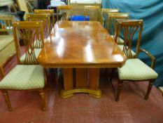 A good quality modern light oak and walnut effect extending dining table with additional leaf