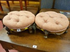 A pair of button upholstered carved walnut circular stools with carved decoration and knurled