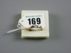 An eighteen carat gold five stone (one missing) diamond dress ring, 2 grms