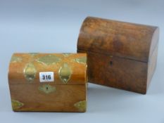 A 19th Century walnut dome topped tea caddy with twin lidded interior compartments, 15 x 18 cms