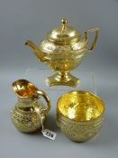 A three piece gilt silver tea service patterned in the classical style, the circular sugar basin and
