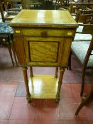 A French style satinwood and walnut single door two tier side cabinet with reeded turned column