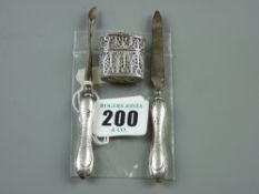 A pair of silver handled manicure pieces and a filigree, believed silver, oval lidded pomade