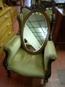 A late Victorian rosewood gent's armchair with carved pierced top rail, carved shallow wing back and