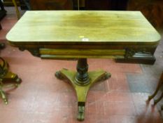 A Victorian rosewood folding card table on carved column tri-form base with carved feet on brass