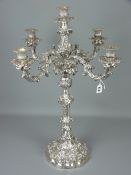 A most impressive silver five sconce, four branch candelabrum with centre hollow cast column