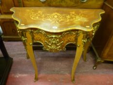 A reproduction serpentine Kingwood side table with brass embellishments, 79 x 102 cms