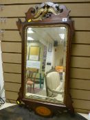 A Regency style mahogany wall mirror of rectangular form with gilt highlighted phoenix bird fretwork