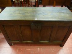 An 18th Century oak coffer with twin plank top, inset moulded edge panels, front and sides with