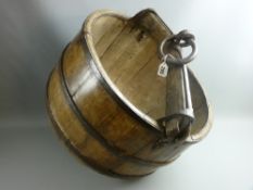 An Eastern wood and iron well bucket of barrel form with iron straps, timber and iron yoke style