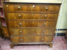 A late 19th/early 20th Century mahogany and crossbanded chest of five long drawers all with brass