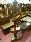 An Edwardian four branch hallstand with lidded storage compartment, 210 cms high
