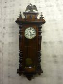 A 19th Century Gustav Becker walnut cased Vienna type regulator, twin weight with painted enamel