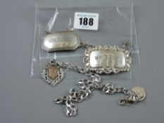 A whisky label, Birmingham 1964; a sherry label, Birmingham 1930; a pendant fob, Birmingham 1916