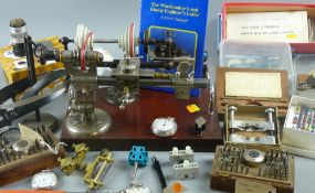 A B.T.M. watchmaker's lathe and oak case with accessories, a quantity of magnifier's and lenses, a