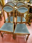 A set of four Art Nouveau high back salon chairs with upholstered back pad and drop-in seats,