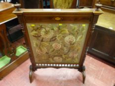 An early Edwardian classically styled inlaid mahogany firescreen with floral woolwork panel, 95 x 70