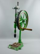 A Union cast iron vintage pillar drill in green, red and black livery with turned wooden handles, 76