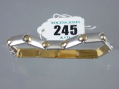 A white metal (marked fourteen carat) satin effect bracelet with yellow metal ball decoration, 13.