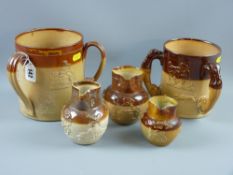 A large three handled Doulton Lambeth tyg with applied drinking scene motifs and a stag hunt