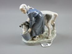 A Royal Copenhagen group of young dairy lady with bucket feeding her calf (slight rim chip to