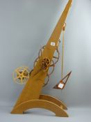A 20th Century hand crafted oak inclination clock with winder, possibly built after a design by