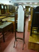 A Bevan Funnell reproduction mahogany cheval mirror with shaped mirror top on splayed feet with
