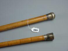 A malacca cane with hallmarked silver pommel grip, 86 cms and a bamboo cane having a white metal