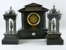A Victorian black slate clock garniture, architectural temple style clock, twin wind movement with