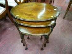 A set of three wavy edged top walnut side tables with carved knees, slender supports on ball and