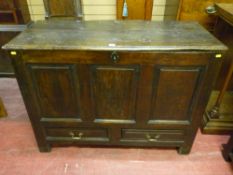An antique oak mule chest, twin plank moulded edge top with triple raised chamfered panel front