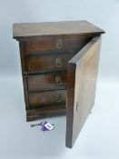 A possibly Italian walnut and burr walnut single door table cabinet with line strung inlay, the