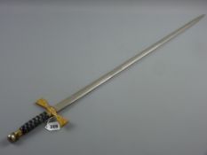 A reproduction commemorative Wilkinson sword with daffodil, leek and lady in Welsh costume