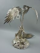 A hollow silver palm tree centrepiece, the twin palm tree trunks having a standing hatted
