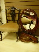 A Victorian mahogany swing toilet mirror with carved frame on a shaped stepped base with front