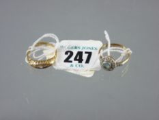 A nine carat gold diamond cluster ring with centre moonstone and diamond shoulders, 3.5 grms and